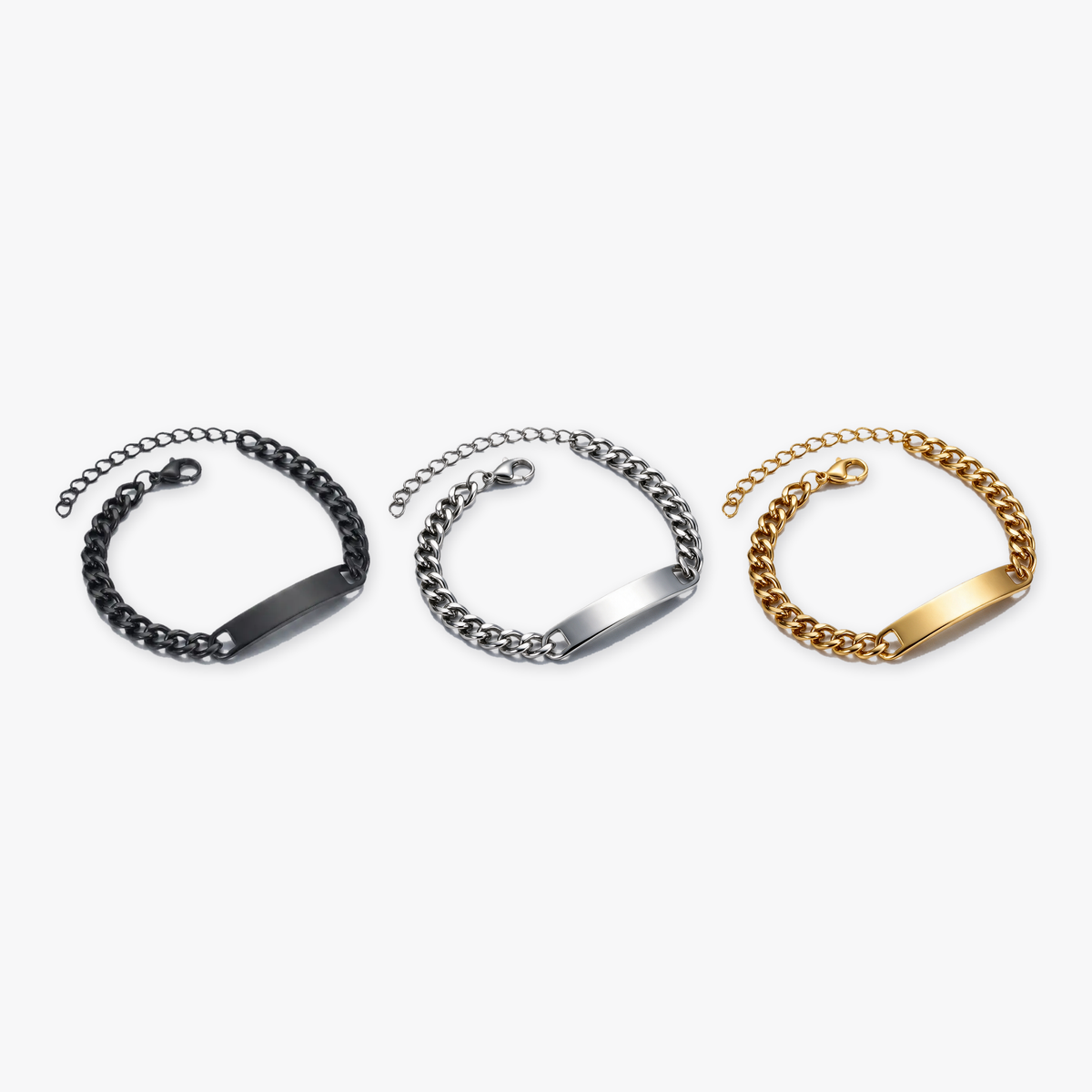 Black, gold and silver engraved ID bracelets shown side by side